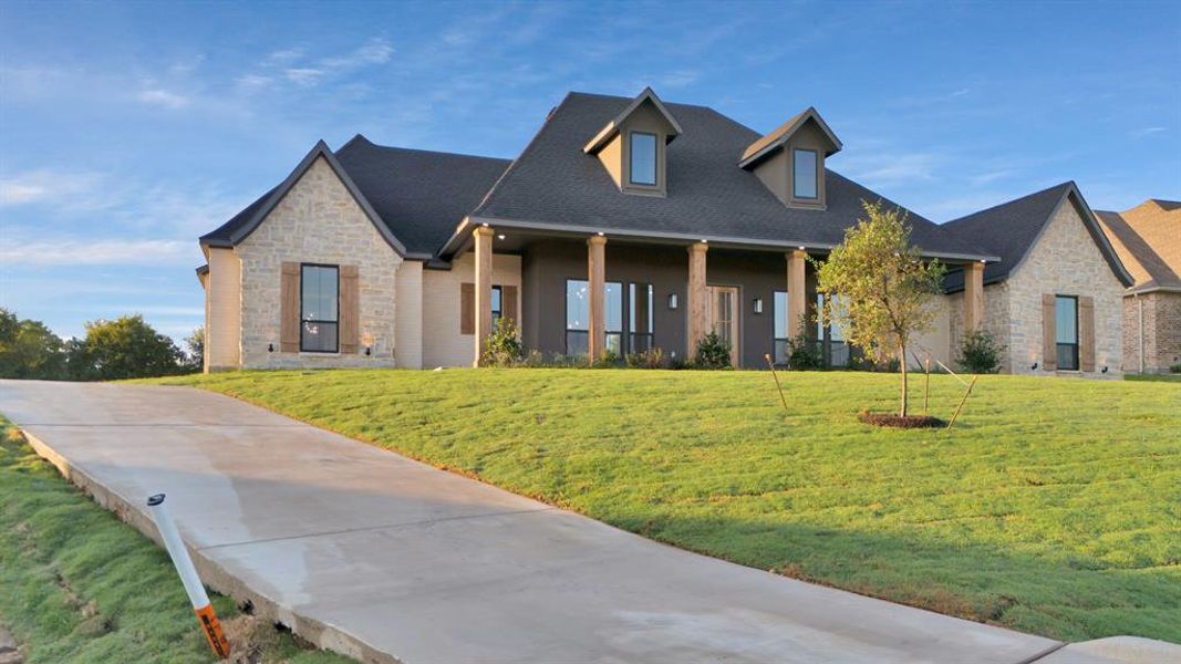 View of front of home featuring a front lawn