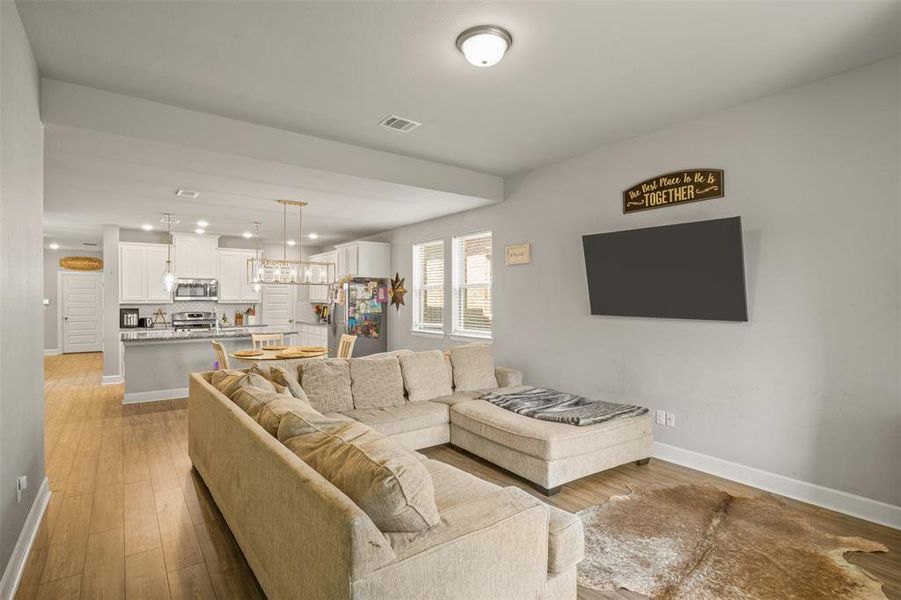 Living room with light wood-type flooring