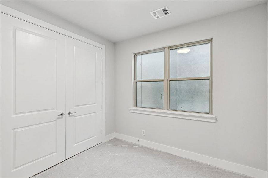 Unfurnished bedroom with a closet