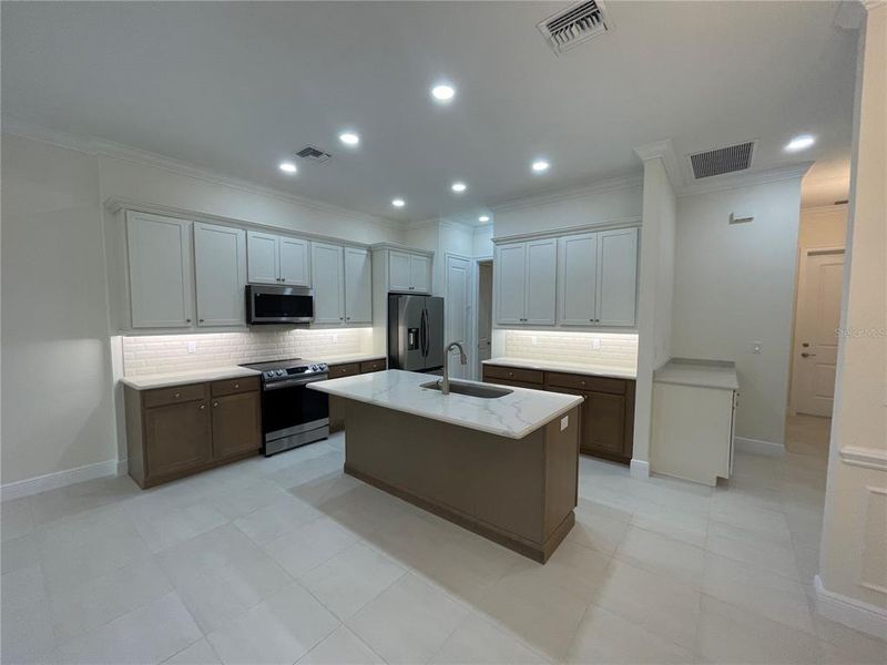 Gourmet kitchen with under cabinet lights