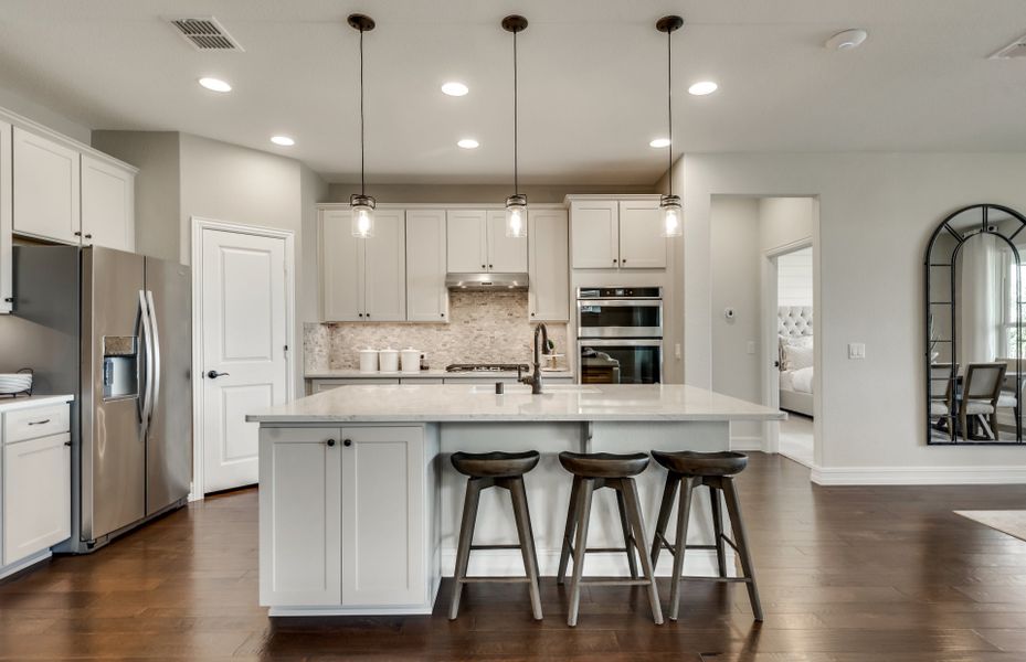 Pendant and recessed lighting in kitchen