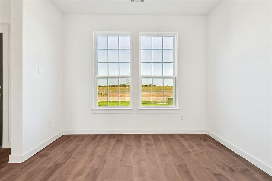 Unfurnished room featuring hardwood / wood-style floors