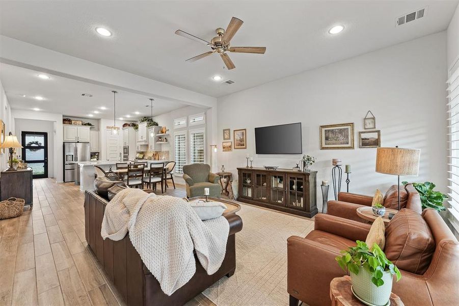 Wood-Look Tile spans the spacious kitchen, dining and living rooms also allowing it to feel light and bright.