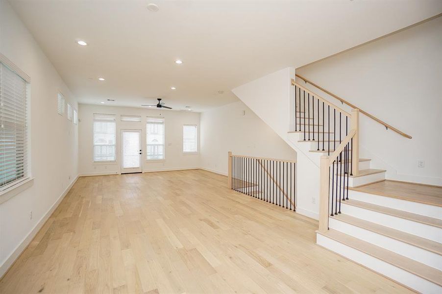 Grand open floorplan with tons of natural light and balcony,Photos of similar completed home by same builder. Selections may differ.