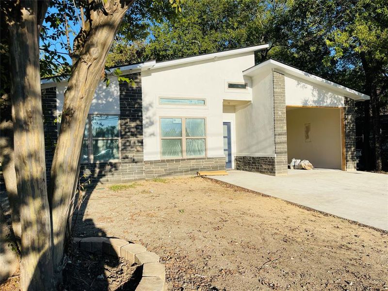 View of front facade with a patio area