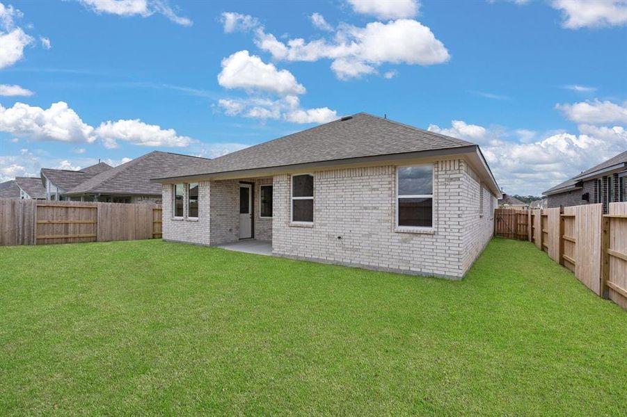 This backyard is perfect for family gatherings, social events, or simply unwinding in the fresh air.