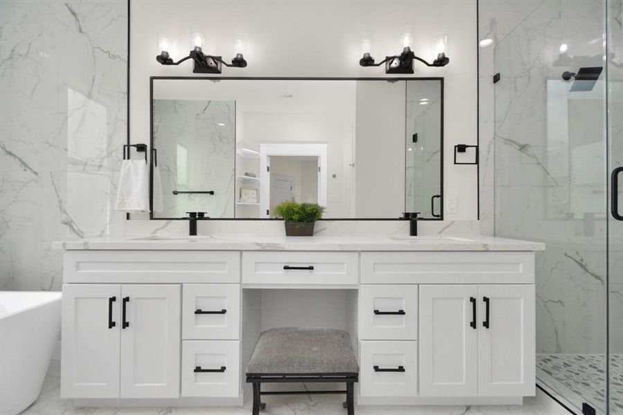 Primary bathroom: Double sink vanity, perfect makeup space, luxury and functionality.