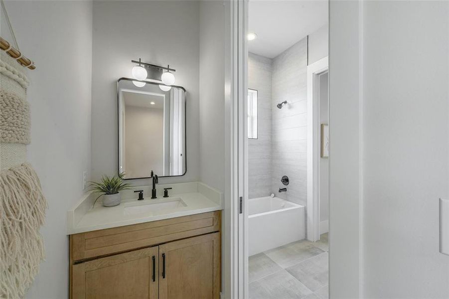 Jack and jill bathroom with tub/ shower area