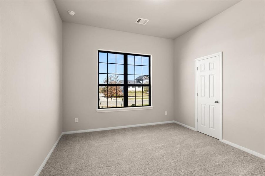 Your secondary bedroom features plush carpet, fresh paint, closet, and a large window that lets in plenty of natural lighting.