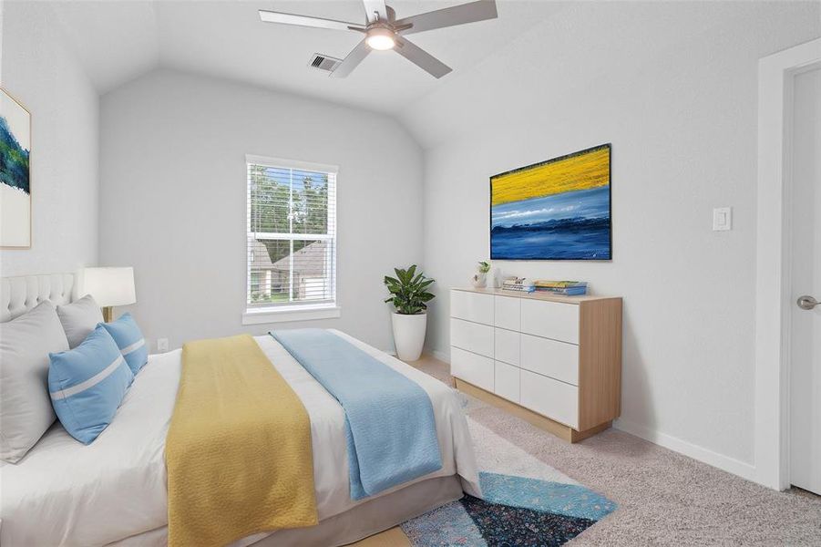 Secondary bedroom features plush carpet, custom paint, ceiling fan, and large window with privacy blinds.