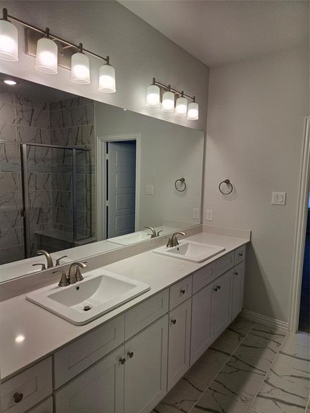 Bathroom with walk in shower and vanity