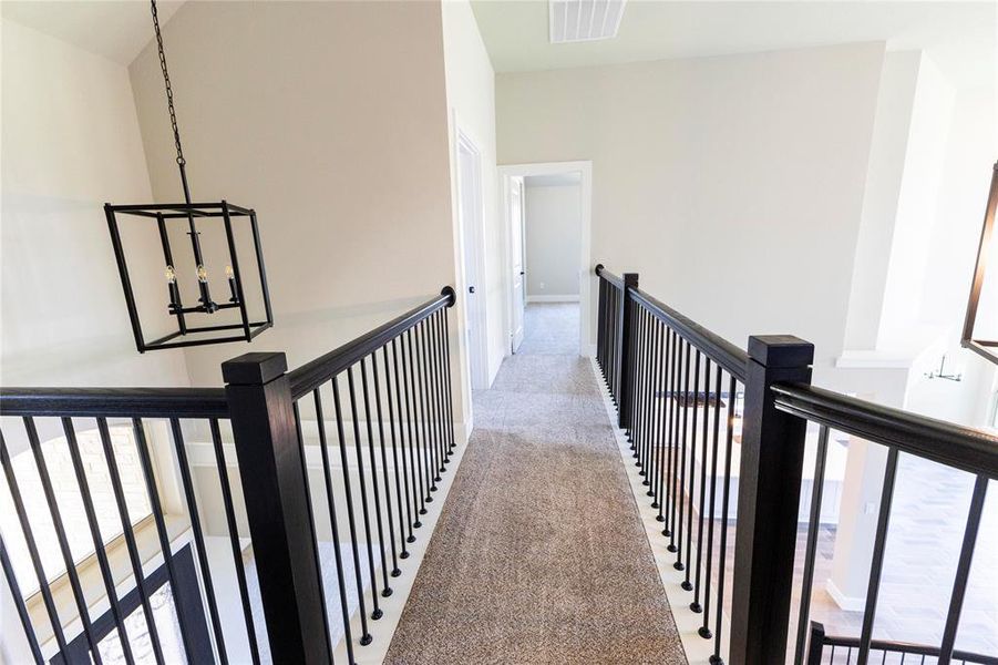 Corridor featuring carpet flooring