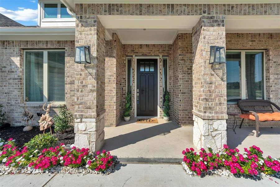 Property entrance featuring a patio area