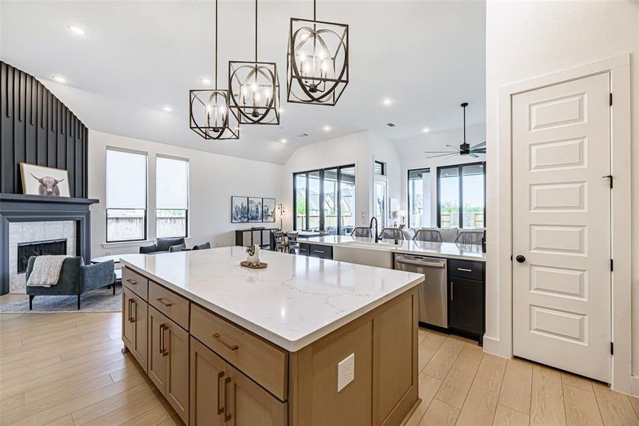 The kitchen is equipped with plenty of cabinet space and a walk-in pantry.