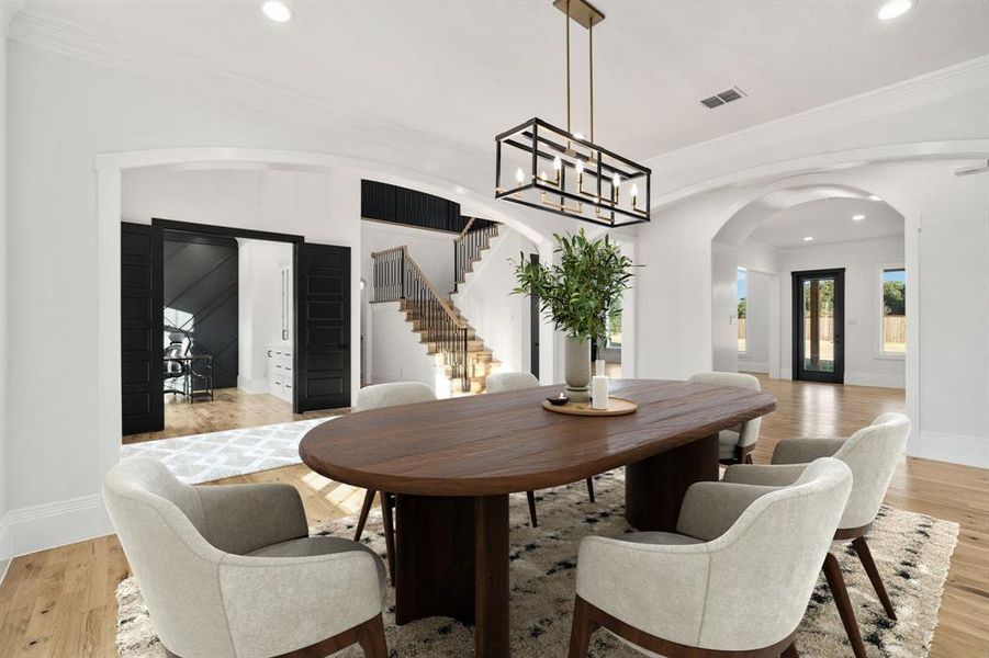 Another angle with views of the office, the impressive staircase, and the back door. *Virtually staged.