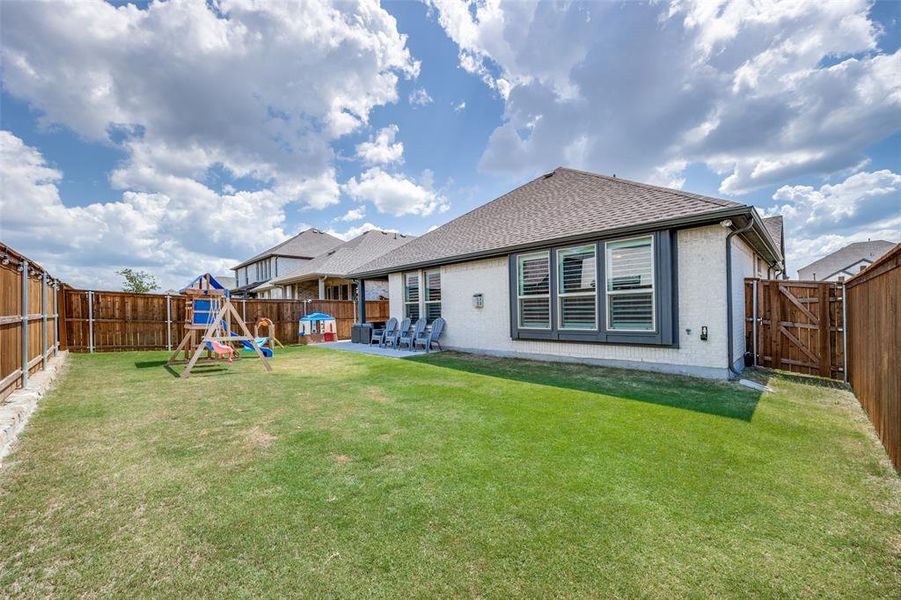 Back of house featuring  a patio