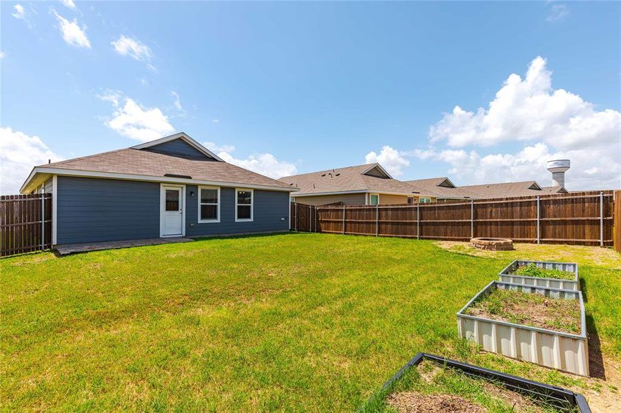 Rear view of property featuring a lawn