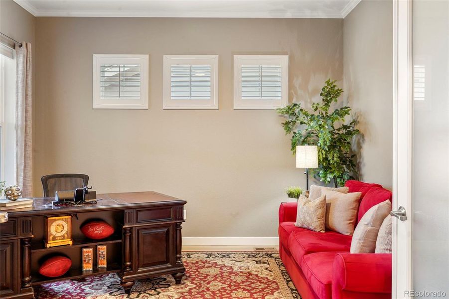 Dedicated main floor office with French doors overlooking front porch