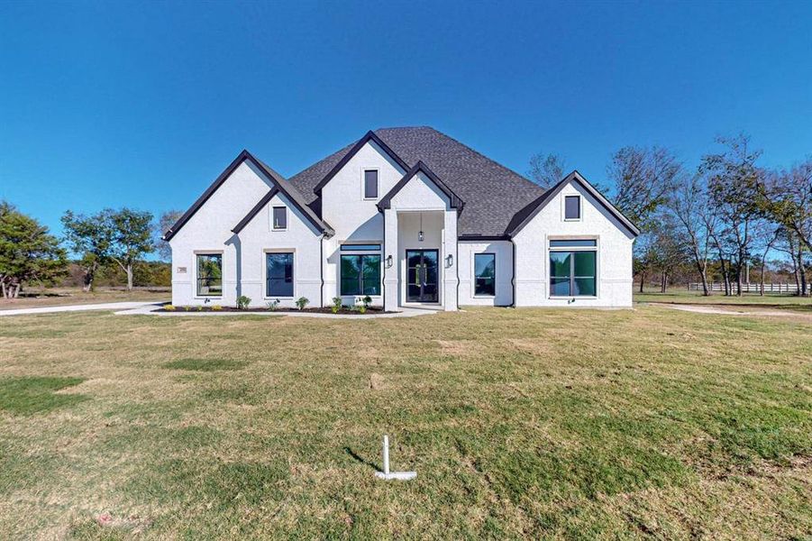 View of front of house with a front yard