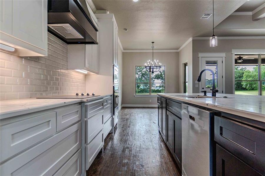 Kitchen featuring white cabinetry, tasteful backsplash, dishwasher, dark hardwood / wood-style flooring, and custom exhaust hood