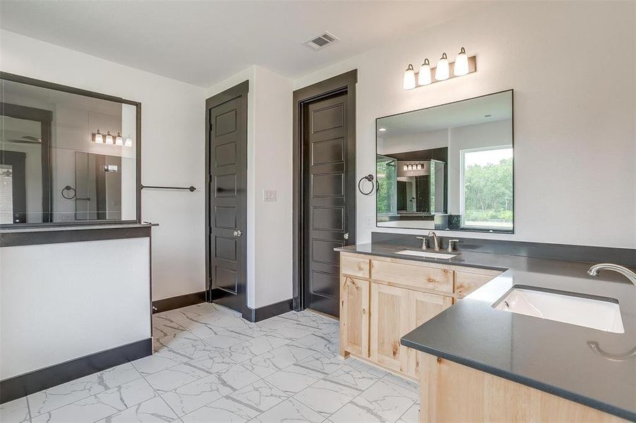 Bathroom with tile floors and vanity