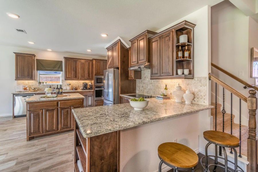 Kitchen | Concept 2379 at Abe's Landing in Granbury, TX by Landsea Homes