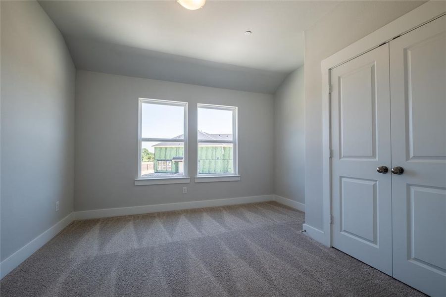 One of two nicely sized secondary bedrooms available in our Estate floor plan.