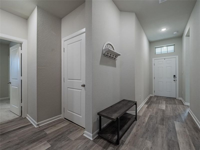 foyer   as you enter you will be welcomed with the beautiful tile wood looking floors. tall ceilings