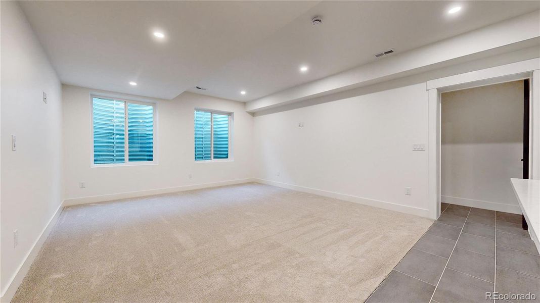 Basement Great Room with Secondary Staircase to Garage