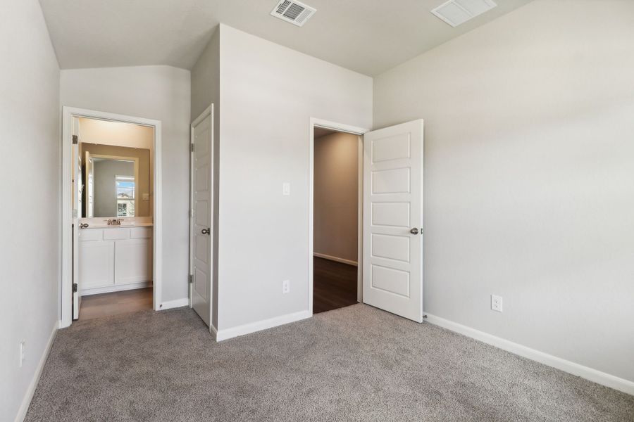 Guest bedroom in the Hughes floorplan at a Meritage Homes community.