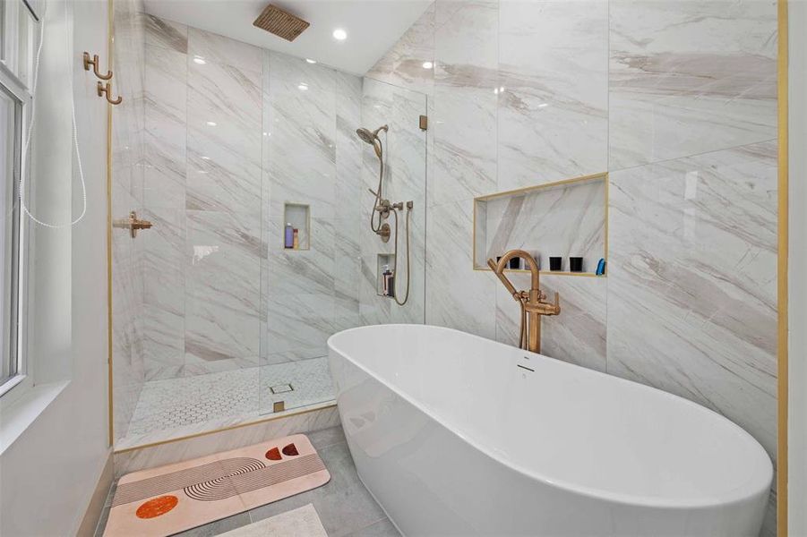 Relax in the luxurious soaking tub, perfect for unwinding after a long day.