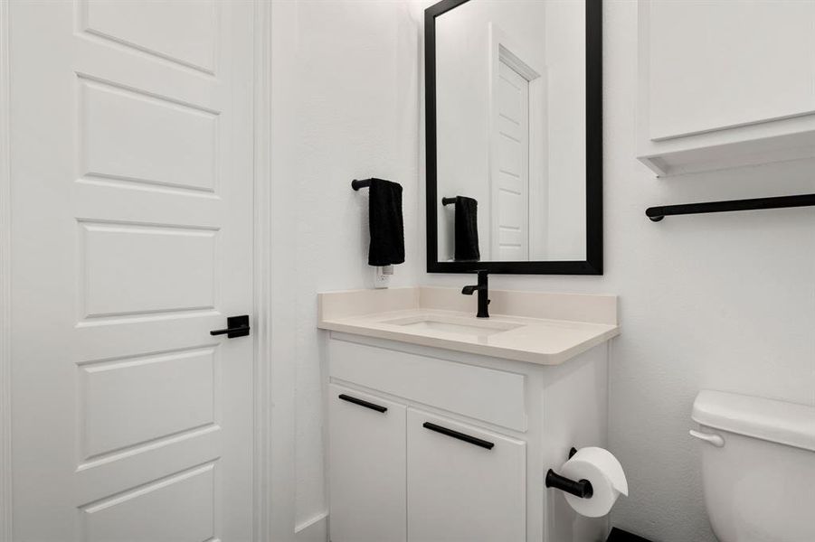 Ensuite Bathroom with vanity, toilet, & walk-in closet