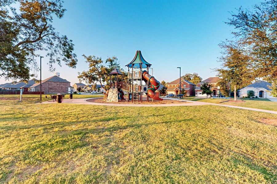 View of play area featuring a yard