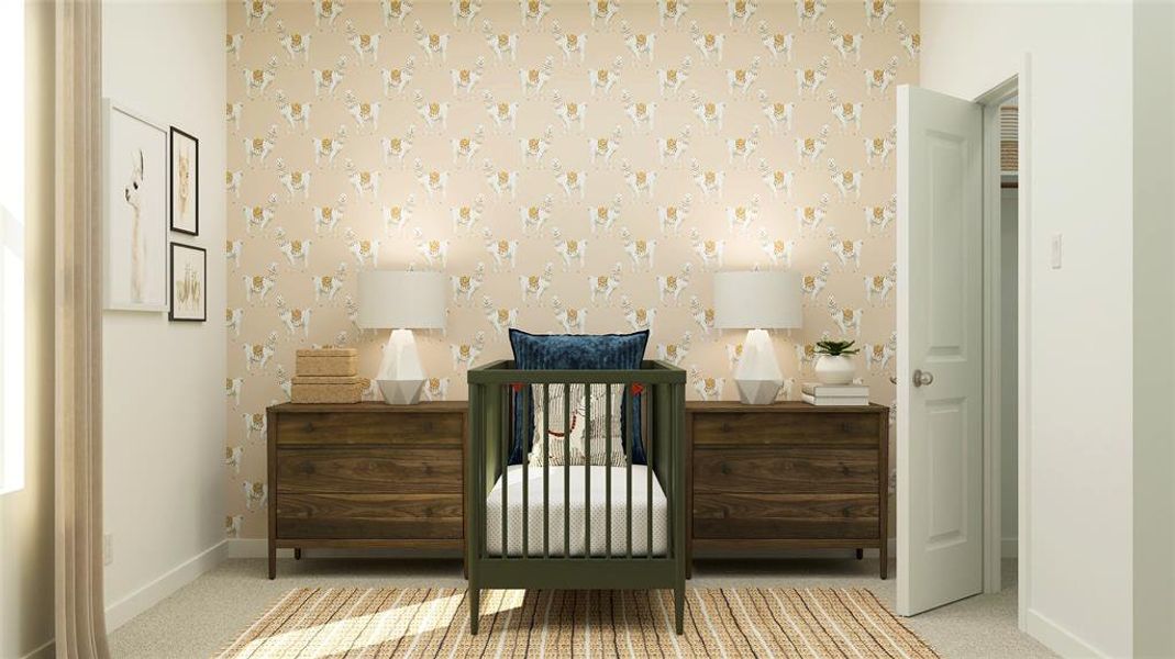 Carpeted bedroom featuring a nursery area