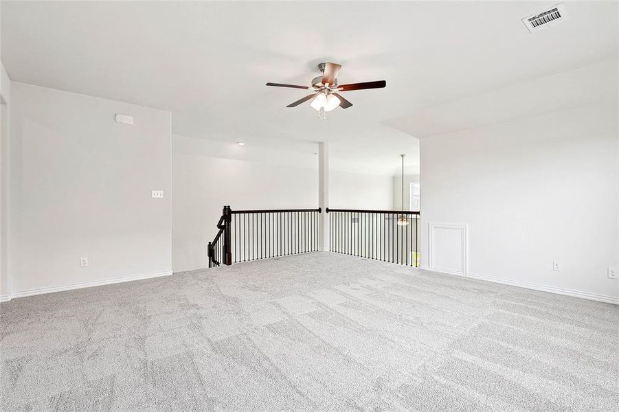 Unfurnished room with carpet flooring and ceiling fan