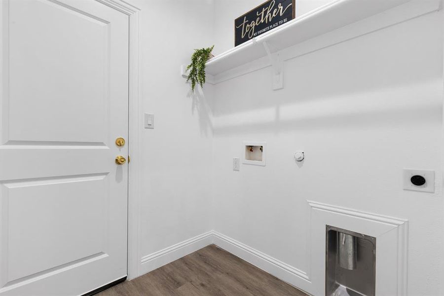 Laundry area featuring washer hookup, dark hardwood / wood-style flooring, hookup for a gas dryer, and electric dryer hookup