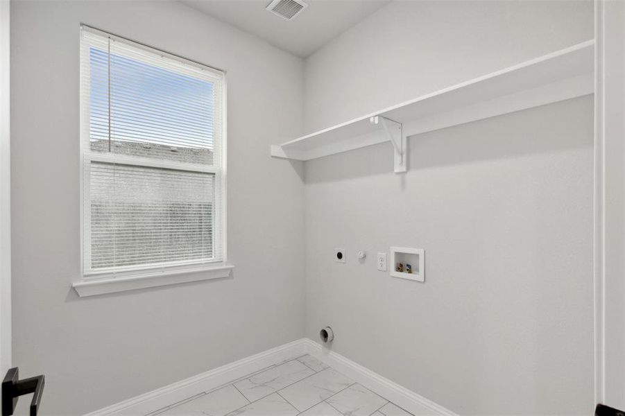 Laundry room featuring washer hookup, gas dryer hookup, and hookup for an electric dryer