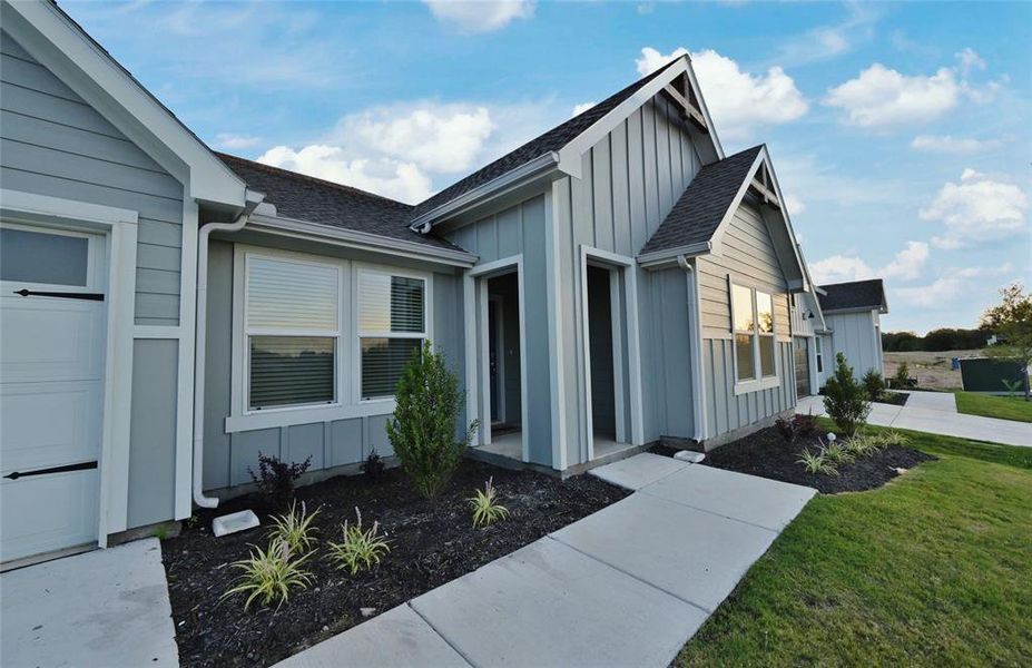 Covered front porch - All Home and community information, including pricing, included features, terms, availability and amenities, are subject to change at any time without notice or obligation. All Drawings, pictures, photographs, video, square footages, floor plans, elevations, features, colors and sizes are approximate for illustration purposes only and will vary from the homes as built.