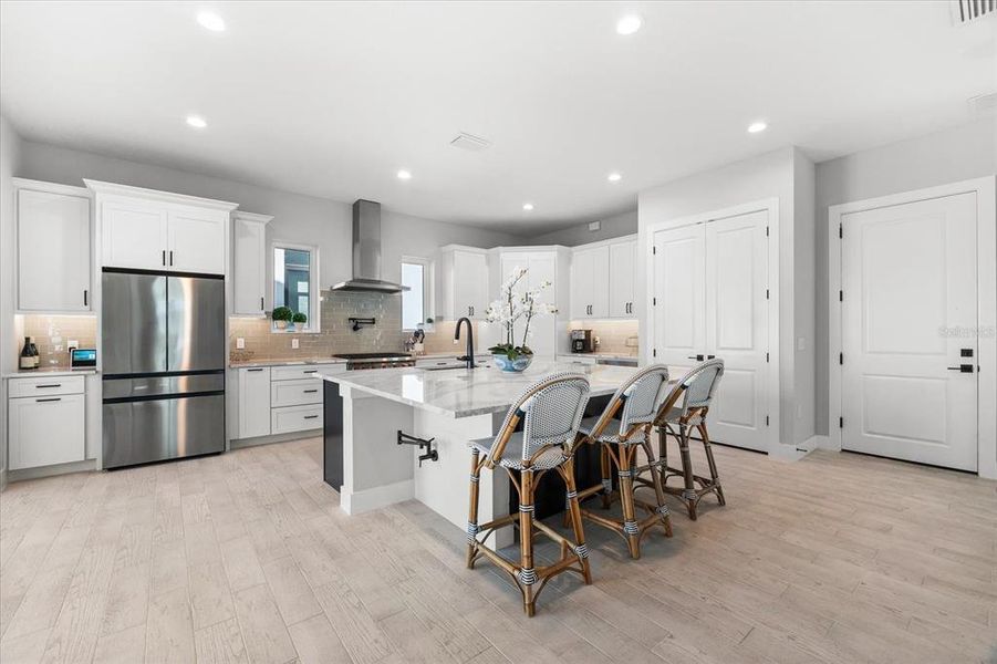 Spacious kitchen with plenty of counter space, cabinets, and natural light.