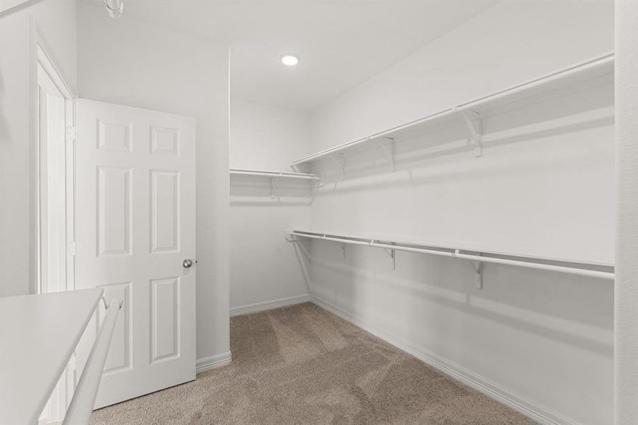 A view of your large primary walk-in Closet