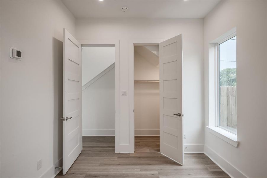 The first floor bedroom has a large closet and opens onto the foyer.