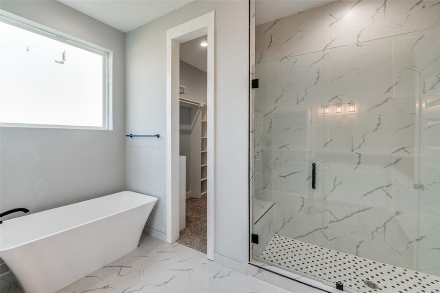 Bathroom with shower with separate bathtub