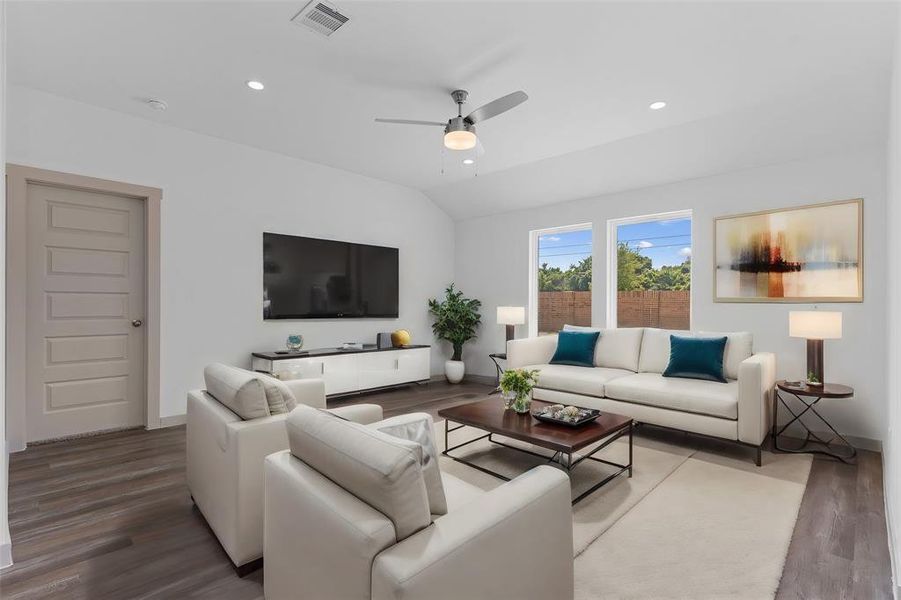 In the Gourmet Kitchen, Casual Dining and Family Room have beautiful wood like plank vinyl carefree flooring! Family Room is with Chic Ceiling fan and more! **Photo is Virtually Staged**