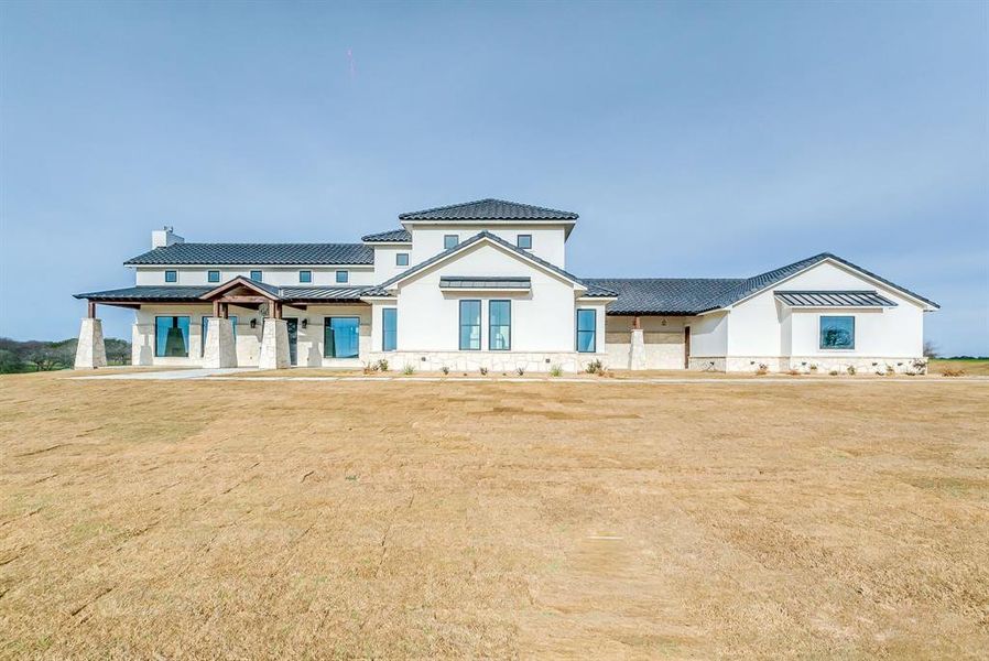 View of front of house with a front yard