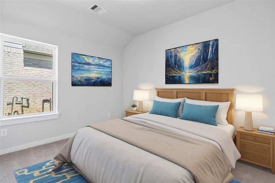 Secondary bedroom features plush carpet, custom paint, lighting, and a large window with privacy blinds.