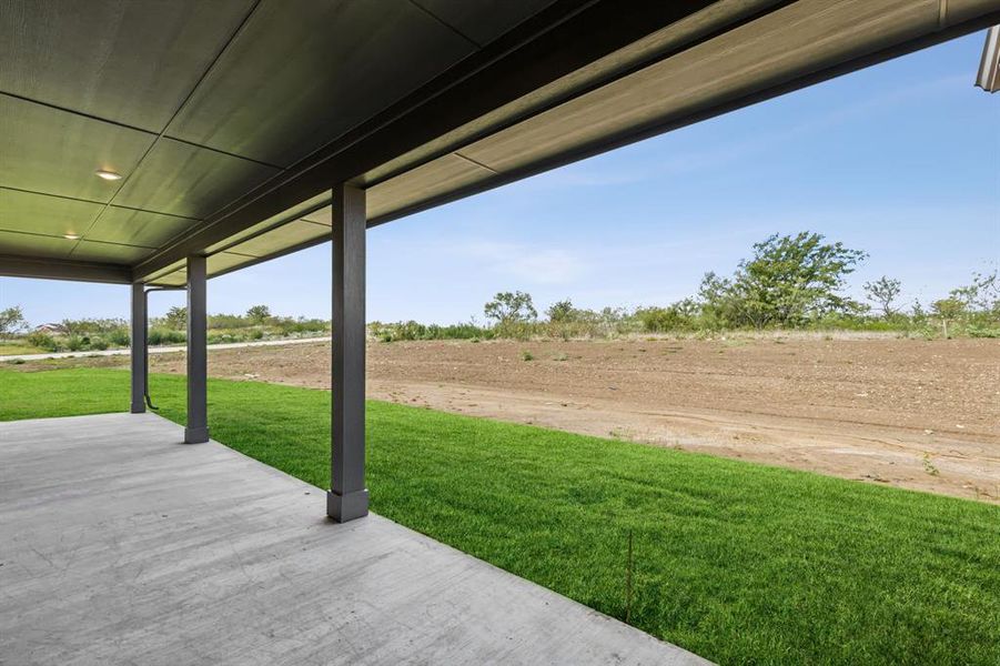 View of yard with a patio area and a rural view