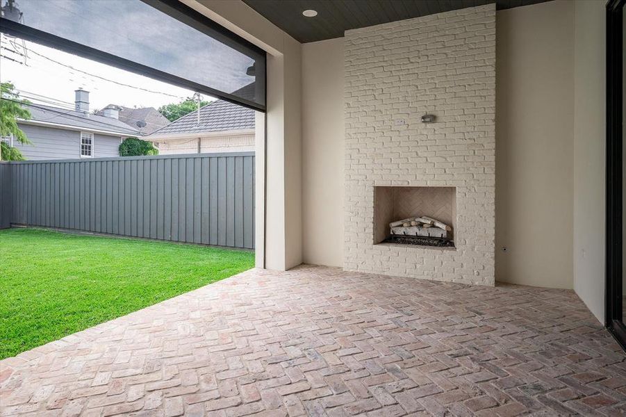 View of patio / terrace featuring an outdoor fireplace