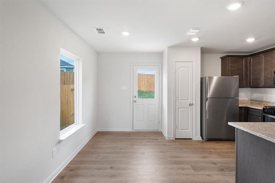 Dining room with light wood-type flooring