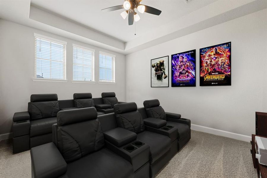 Grab the popcorn, put on a movie, and enjoy a wonderful evening in your amazing media room! Featuring plush carpet, neutral paint, and trey ceilings, making this the perfect room for relaxing.