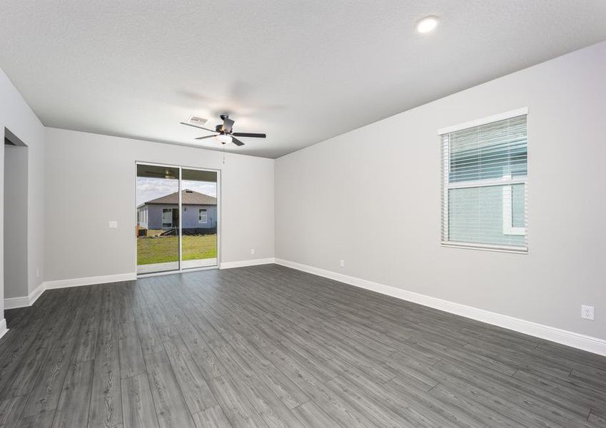 A sliding door in the family room leads to the back yard